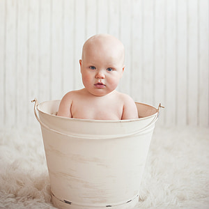 baby inside white pail thumbnail