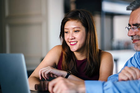 Woman And Man Looking At Laptop thumbnail