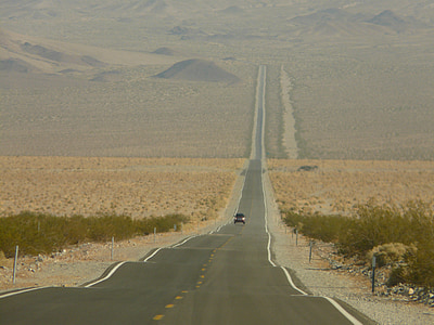 car driving on Death Valley road during daytime thumbnail