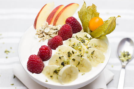 sliced banana, strawberries, apples and peach topped oatmeal thumbnail