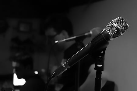 two men in front of microphones thumbnail