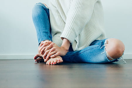 person holding right foot thumbnail