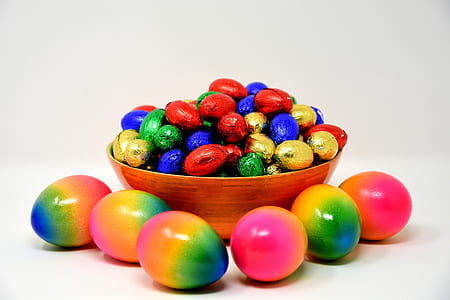 assorted-color easter eggs and chocolate balls thumbnail