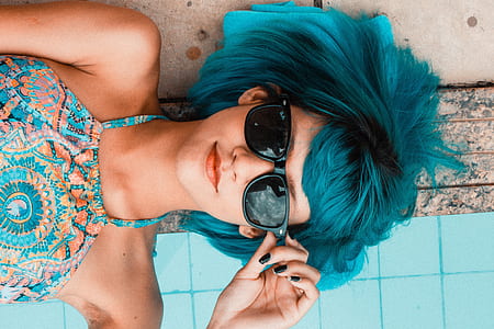blue haired woman wearing black framed sunglasses thumbnail