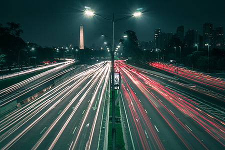 time lapse photography of road filled with cars thumbnail
