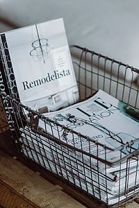 Magazines in a metal basket thumbnail
