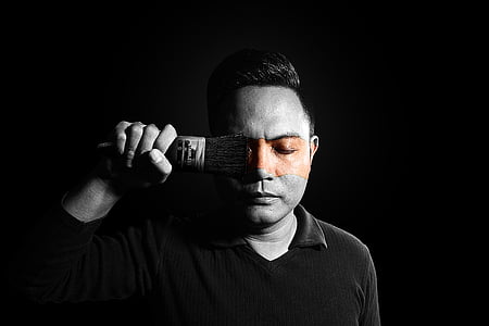 grayscale photography of man holding paintbrush thumbnail