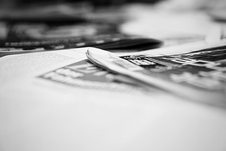 grayscale photo of newspaper thumbnail