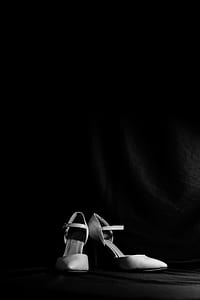 grayscale photography of women's ankle-strap pointed-toe pumps thumbnail