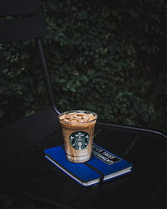 Starbucks glass on blue and white book thumbnail