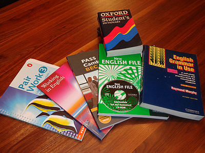 six assorted-color-and-title reading books on brown wooden surface thumbnail