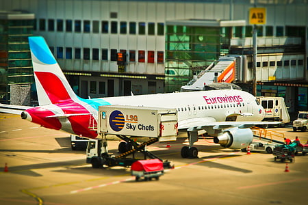 Eurowings airlines near gray concrete building thumbnail