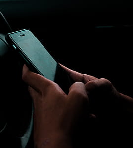 Person Holding Space Gray Iphone 6 and Black Case thumbnail