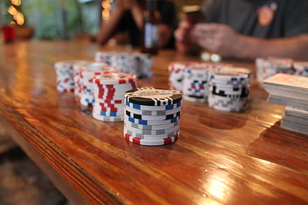 selective focus photography of poker chips on table thumbnail