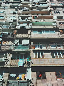 low angle photography of concrete residential buildings during daytime thumbnail
