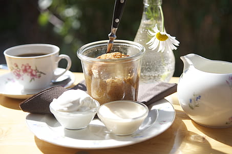white cream in round glass bowl on white ceramic plate thumbnail