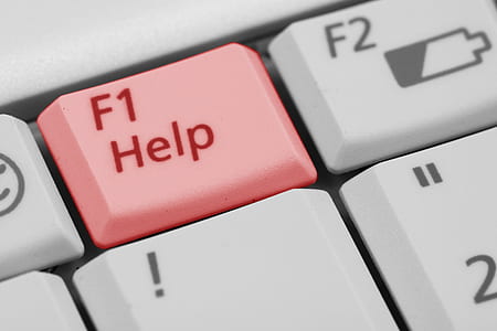 computer gray keyboard with red F1 help button thumbnail