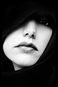 grayscale photo of woman wearing black scarf thumbnail