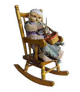brown doll on brown wooden rocking chair thumbnail