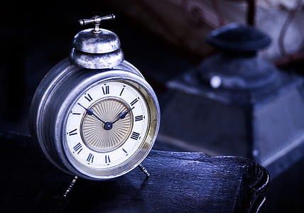 depth of field photography of gray desk clock at 2:50 thumbnail