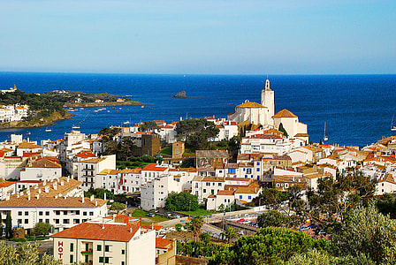 aerial photography white painted building near sea at daytime thumbnail