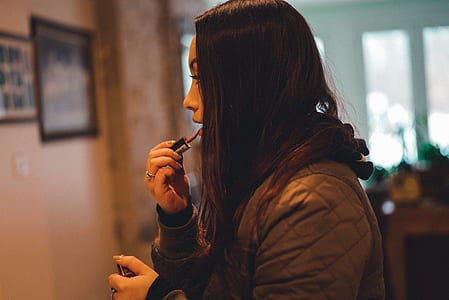 woman putting makeup thumbnail