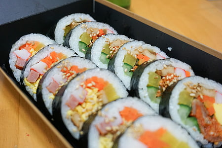 selective focus photography of sliced rice sushi on box thumbnail