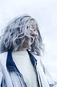 woman wearing eyeglasses with gold frames thumbnail
