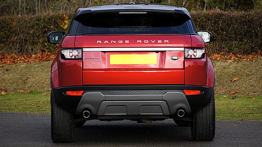 red Ram Range Rover SUV parked thumbnail