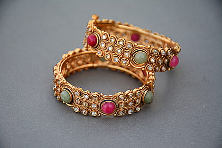 two gold-colored bracelets thumbnail