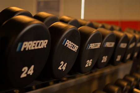 pile of black Precor dumbbells thumbnail