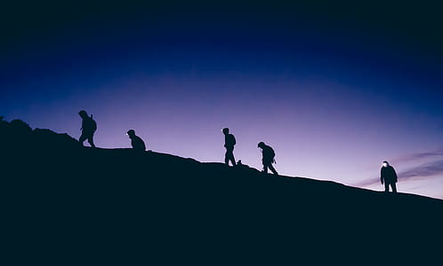 silhouette of five people on top of hill thumbnail