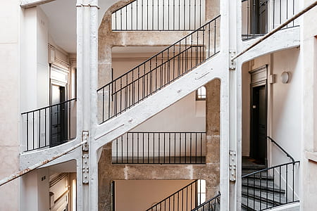empty staircase with black metal railings thumbnail
