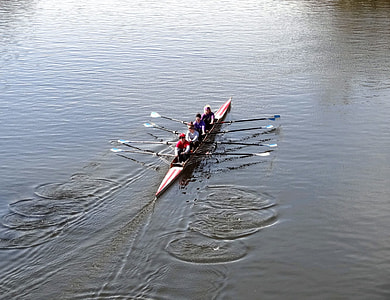 four persons riding boat on body of water thumbnail
