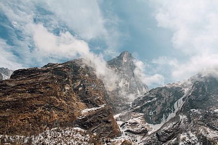 mountains and clouds during daytime thumbnail