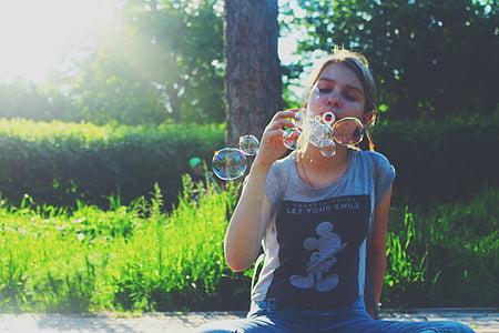 woman playing with bubbles thumbnail