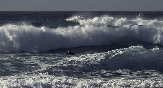 Person Surfing on Ocean thumbnail