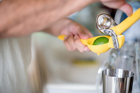 Person Holding Yellow Plastic Ornament thumbnail