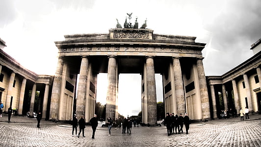 group of people standing near arch thumbnail