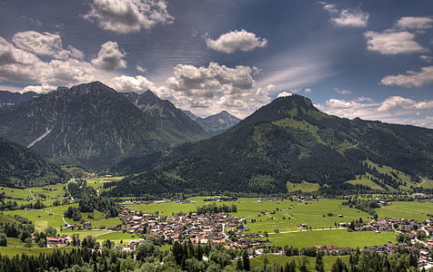 bird's-eye view of mountain under cloudy sky thumbnail