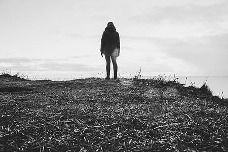 Grayscale Photo Of Person In Parka Coat thumbnail