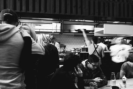 grayscale photography of people inside room thumbnail