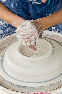 person making clay pot thumbnail