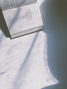 opened white book thumbnail