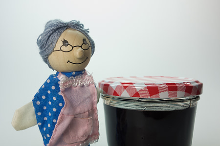 woman plush toy beside mason jar thumbnail