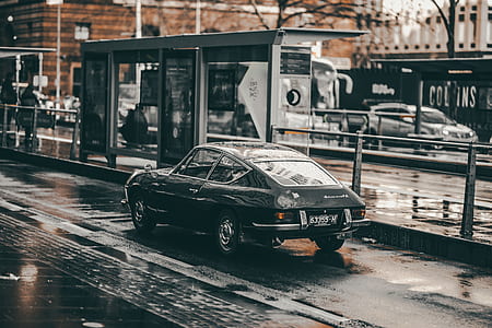 black 3-door hatchback running on the road thumbnail