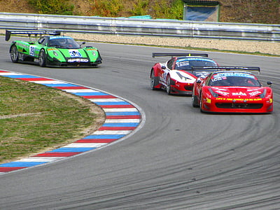 three race cars on track thumbnail