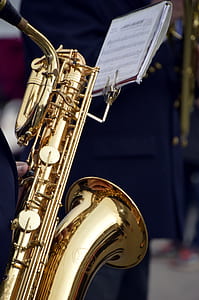 person holding saxophone thumbnail