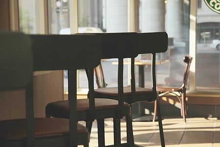 low angle photography of three black-and-red leather-padded wood-framed bar stools thumbnail