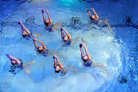 eight people practicing dance in body of water thumbnail